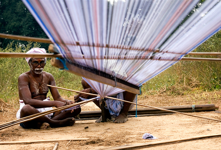 A weaver preparing the warp in a village near Kanchipuram, India.
